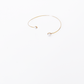 Open gold bracelet adorned with varying sizes of pearls by Hikaru Pearl