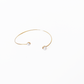 Open gold bracelet adorned with varying sizes of pearls by Hikaru Pearl