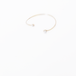 Open gold bracelet adorned with varying sizes of pearls by Hikaru Pearl