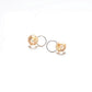 Golden hoop earrings with Circle Art resin design, adorned with a delicate freshwater Pearl and golden leaf accent
